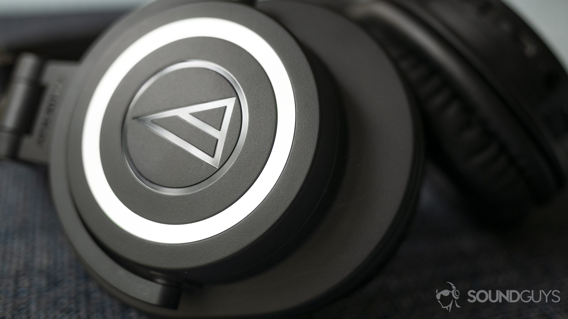audio-technica-ath-m50xbt-logo A photo of the Audio-Technica ATH-M50xBT on a table.